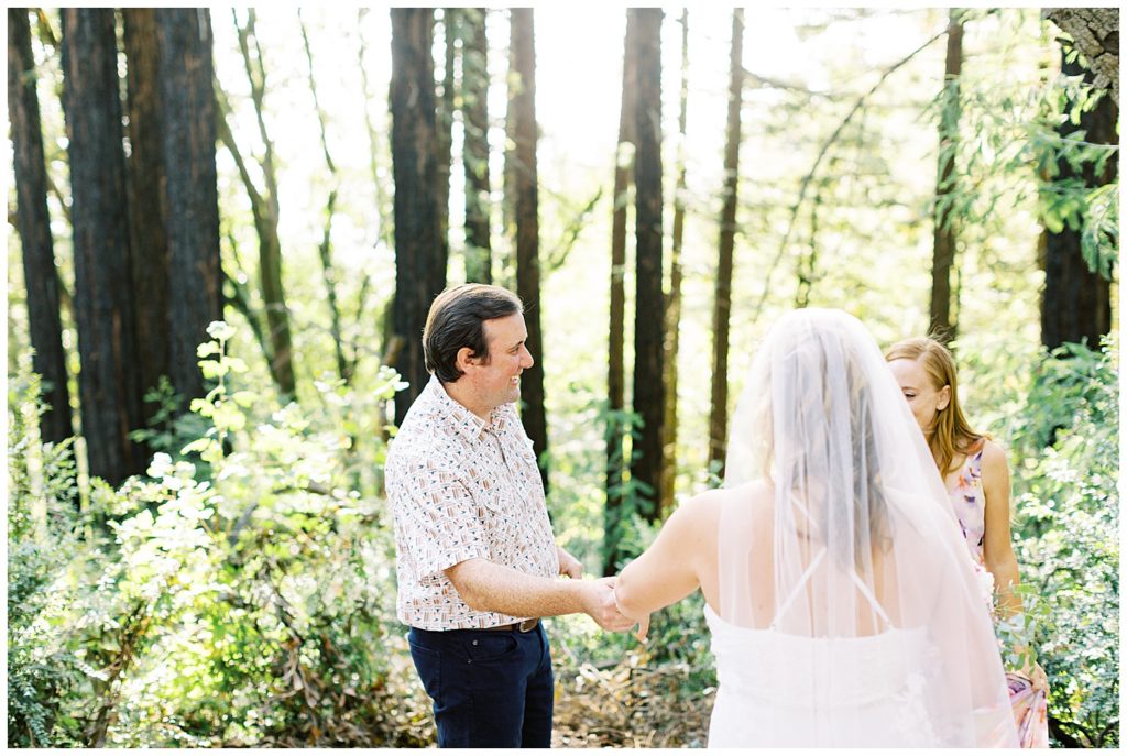 The bridge, groom, and officiant in Oakland's Joaquin Miller Park