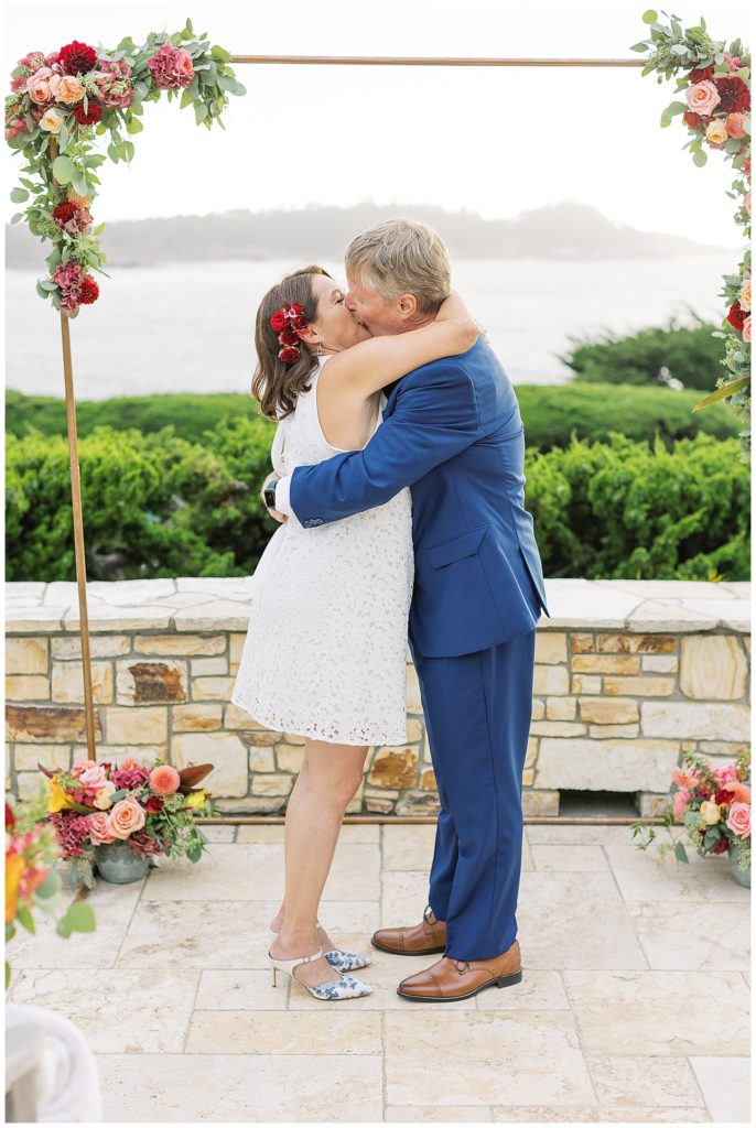 bride and groom sharing a kiss at their private Carmel estate elopement