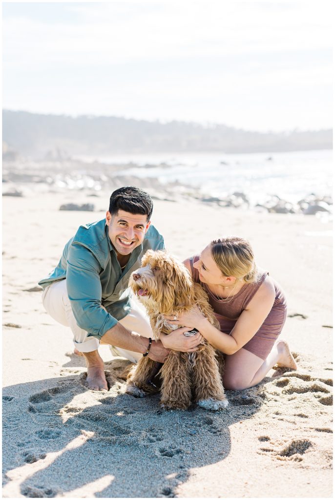 a couple hugging their puppy during Carmel surprise proposal