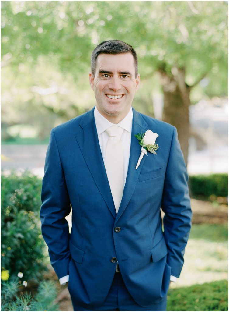 portrait of the groom in his blue suit