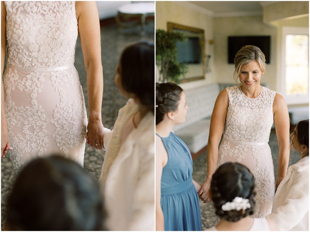 bride holding hands with her daughters