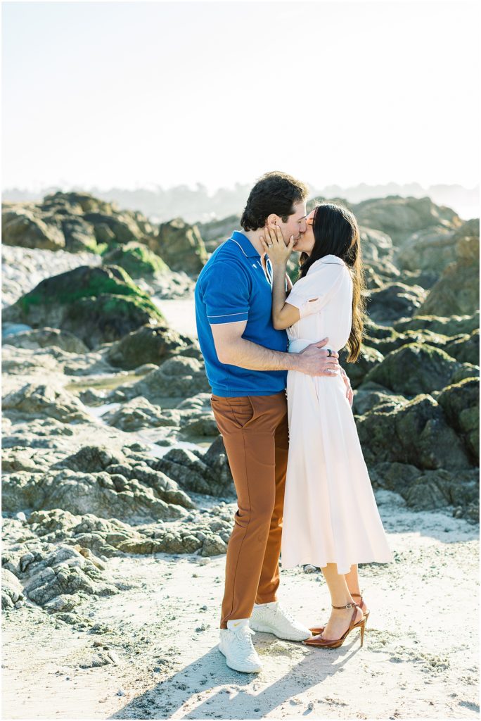 portrait of a couple kissing at Pebble Beach