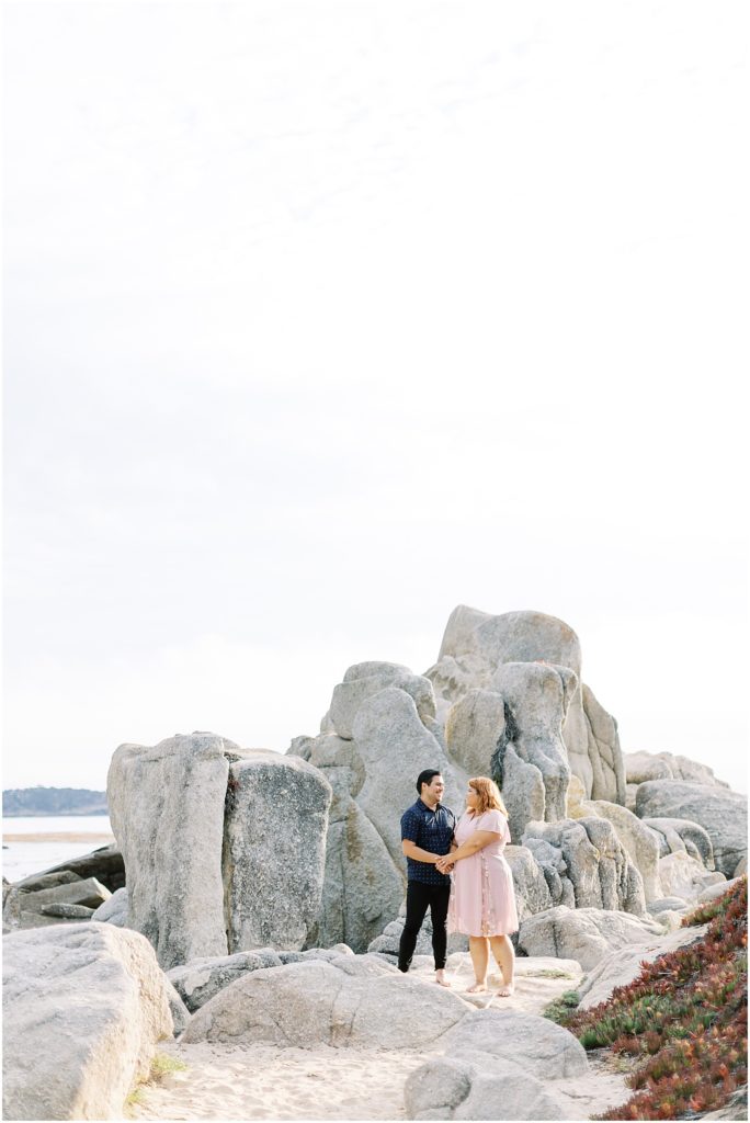 portrait of couple standing by boulder by film photographer AGS Photo Art 