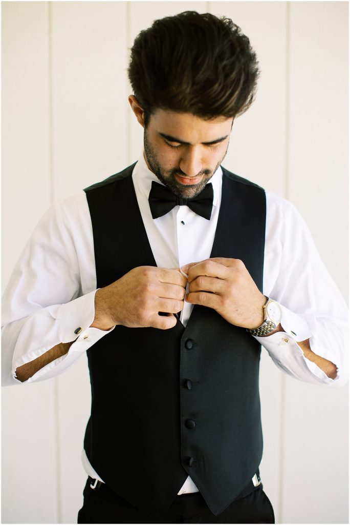 portrait of groom getting ready  by film photographer AGS Photo Art 