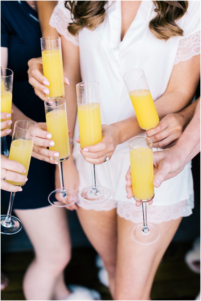 portrait of bridesmaids celebrating with cocktails by film photographer AGS Photo Art