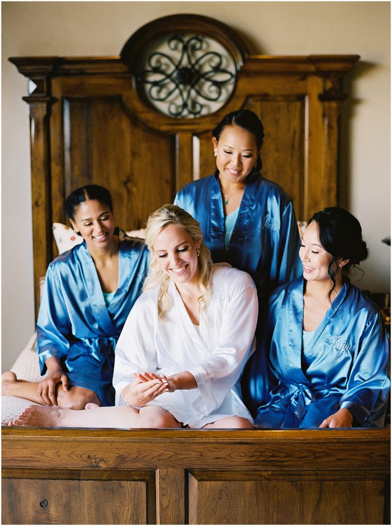 portrait of bride getting ready with bridesmaids by film photographer AGS Photo Art
