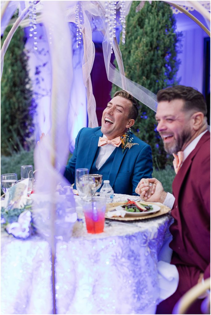 portrait of couple laughing at reception table by film photographer AGS Photo Art