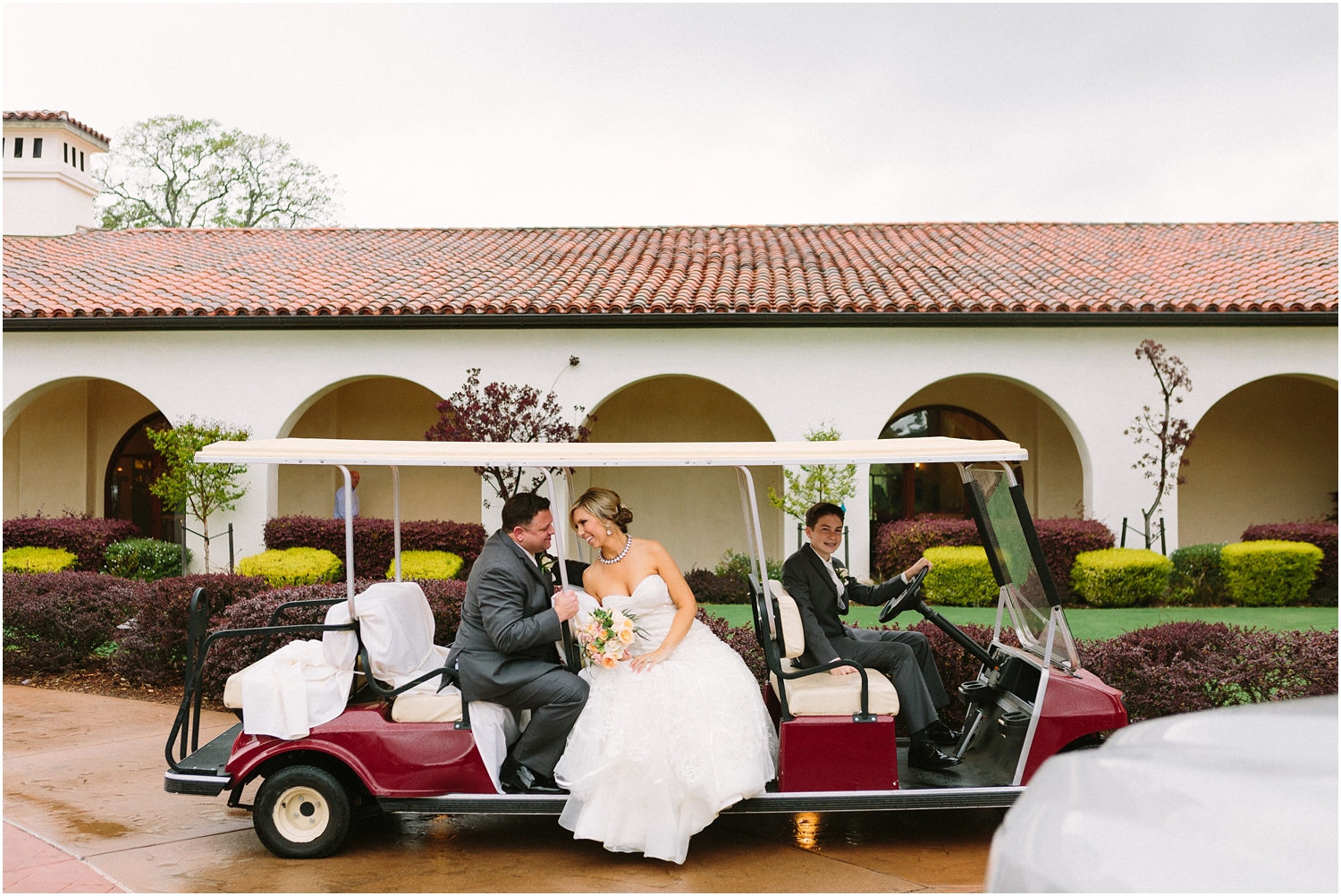 bride and groom outdoor portraits at country club wedding in california on golf cart of golf club