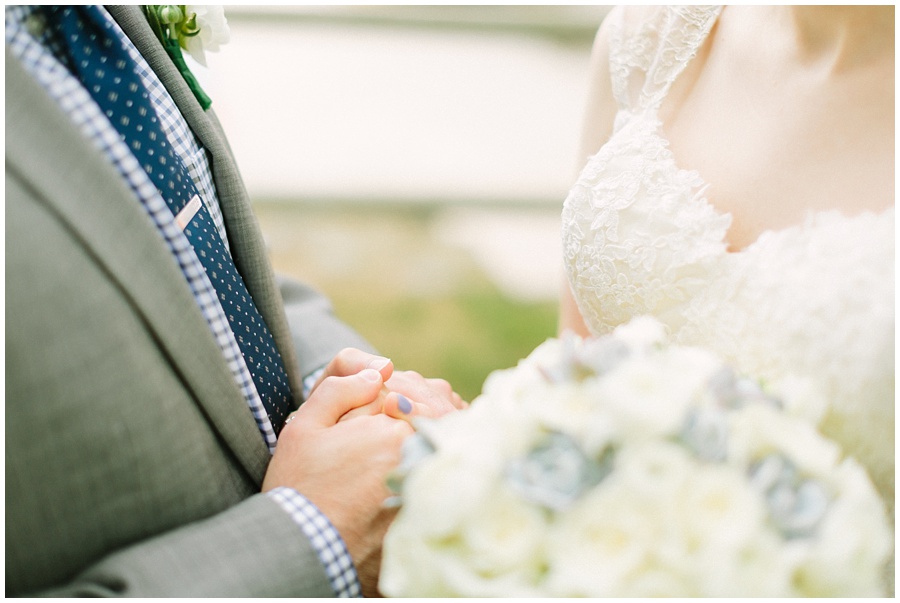 bride and groom holding hands wedding details