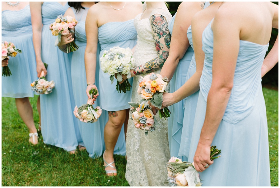 tattooed bride with light blue bridesmaids