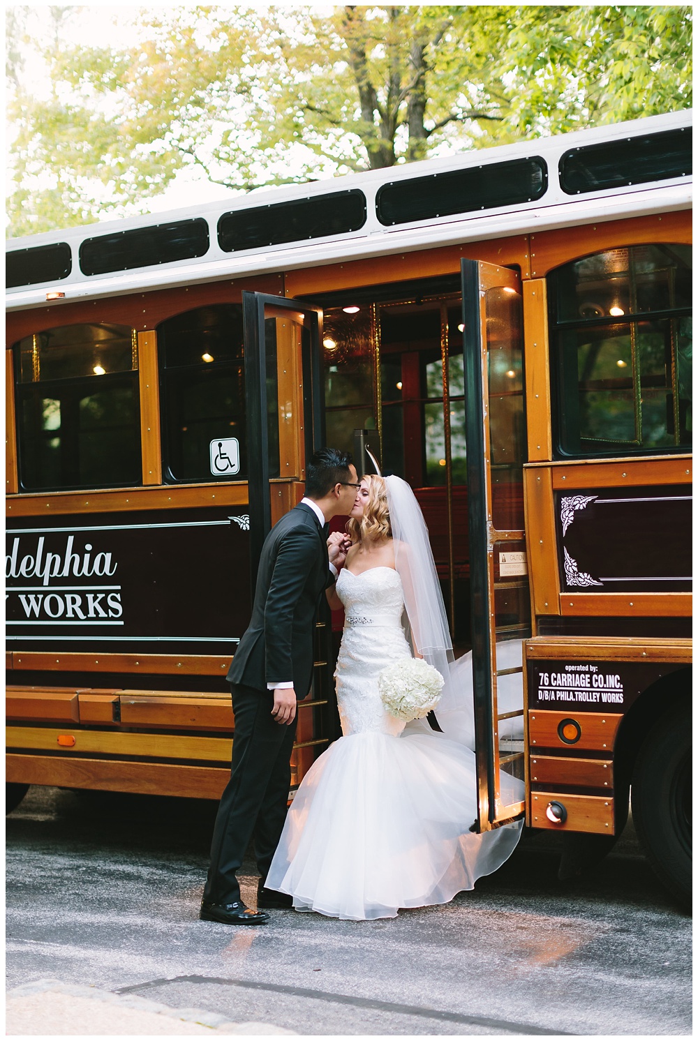 Bride and groom posing in front of the Philadelphia Trolley by AGS Photo Art