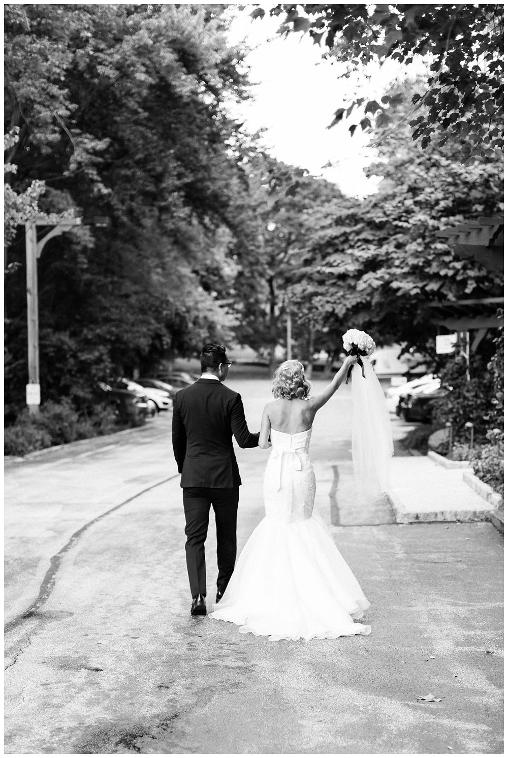Bride and groom walking down street in Radnor PA by film photographer AGS Photo Art