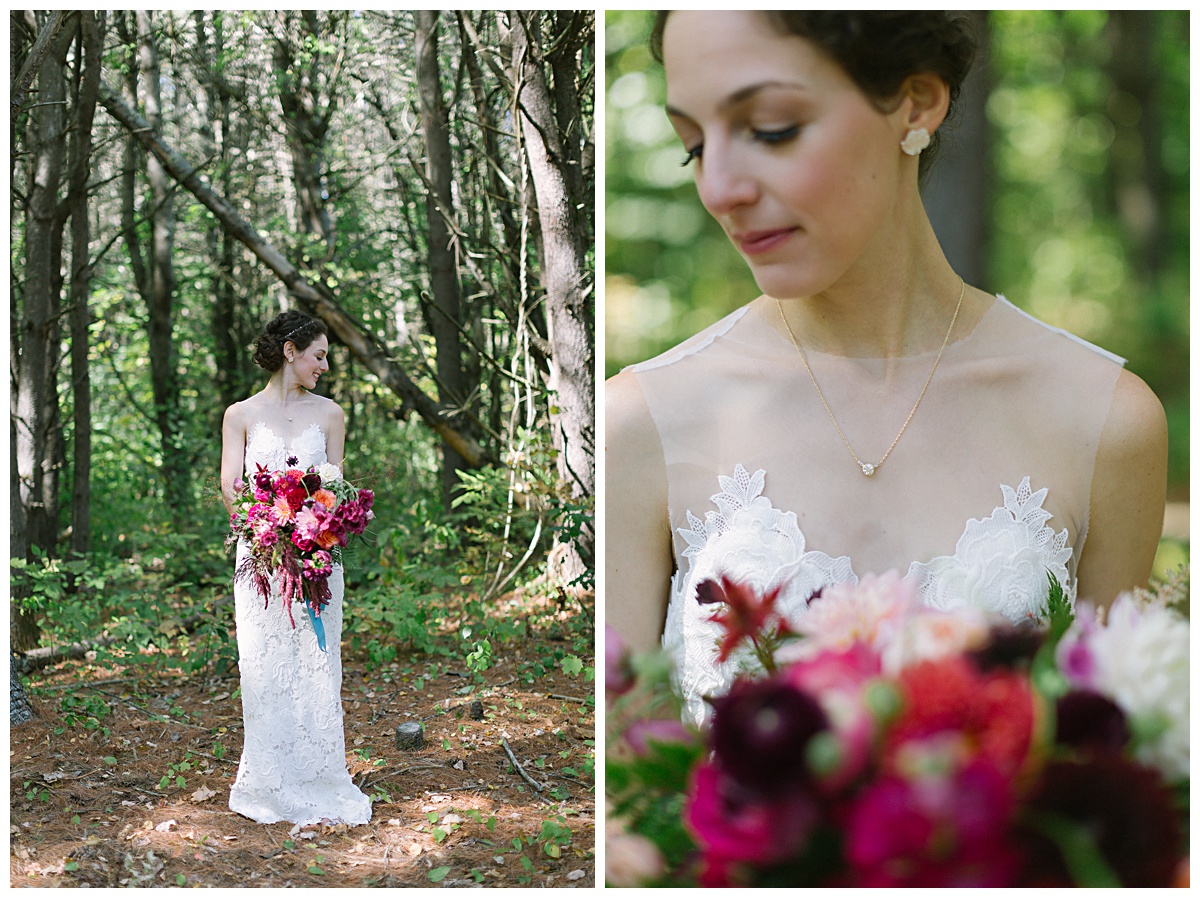 Bride standing in the woods with gorgeous burgundy and magenta wild bouquet