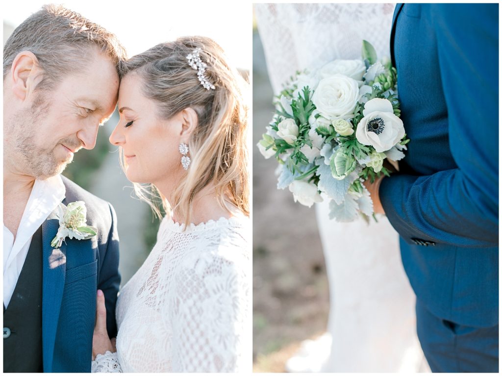 Couple touching their foreheads together and holding white ranunculus
