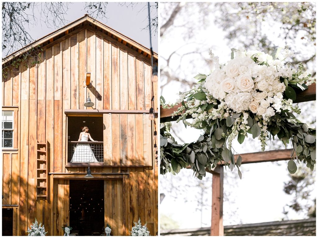 Bride stands in window of The Barns at Cooper Molera in Monterey and arch ceremony florals 