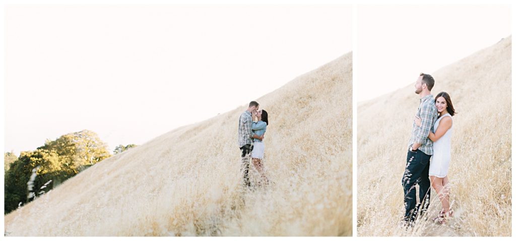 Cute couple poses for engagement photos in the golden hills of California