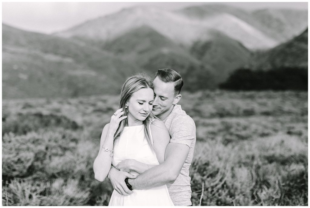 black and white landscape couples portrait in a field