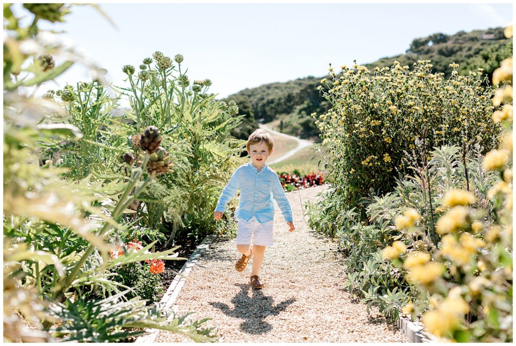 little-boy-running-through-garden-carmel-valley-ranch-ags-photo-art

