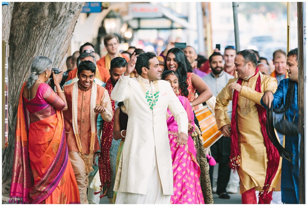 Baraat procession colorful attire celebration in the streets of Monterey California 