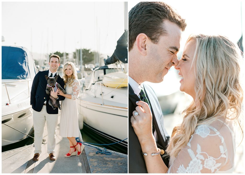 Engagement portraits on the docks of couple holding their French bulldog, smiling at each other with scrunched noses