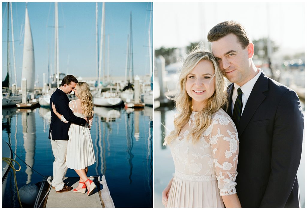 couple's Engagement portraits surrounded by blue waters and tall sailboats by film photographer Ags Photo Art