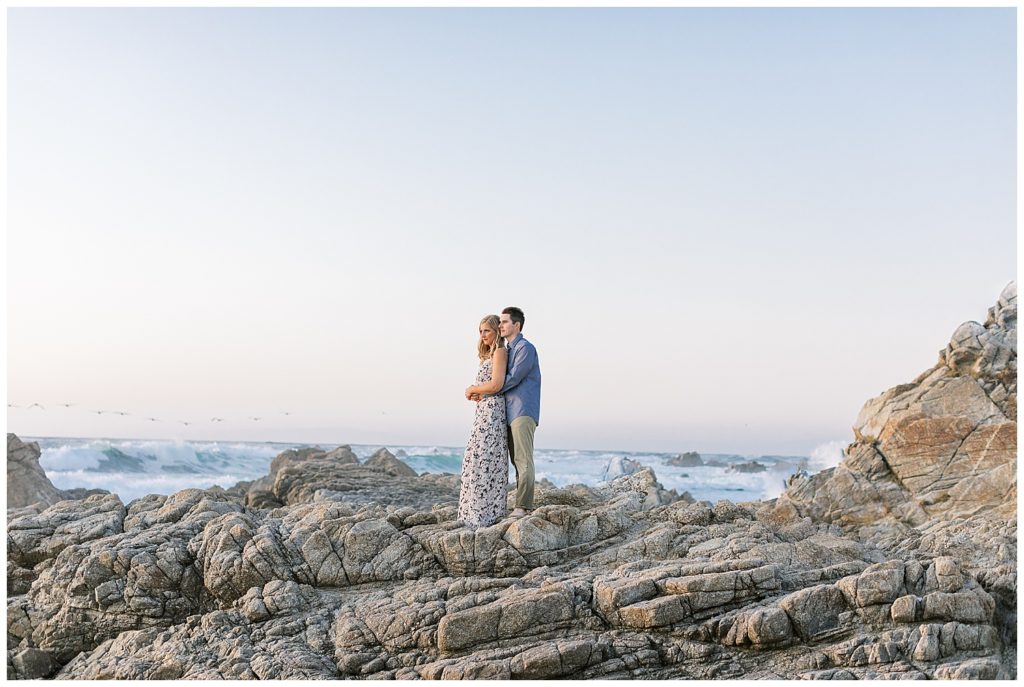 landscape photo of couple under a clear blue sky at Pebble Beach by film photographer Ags Photo Art