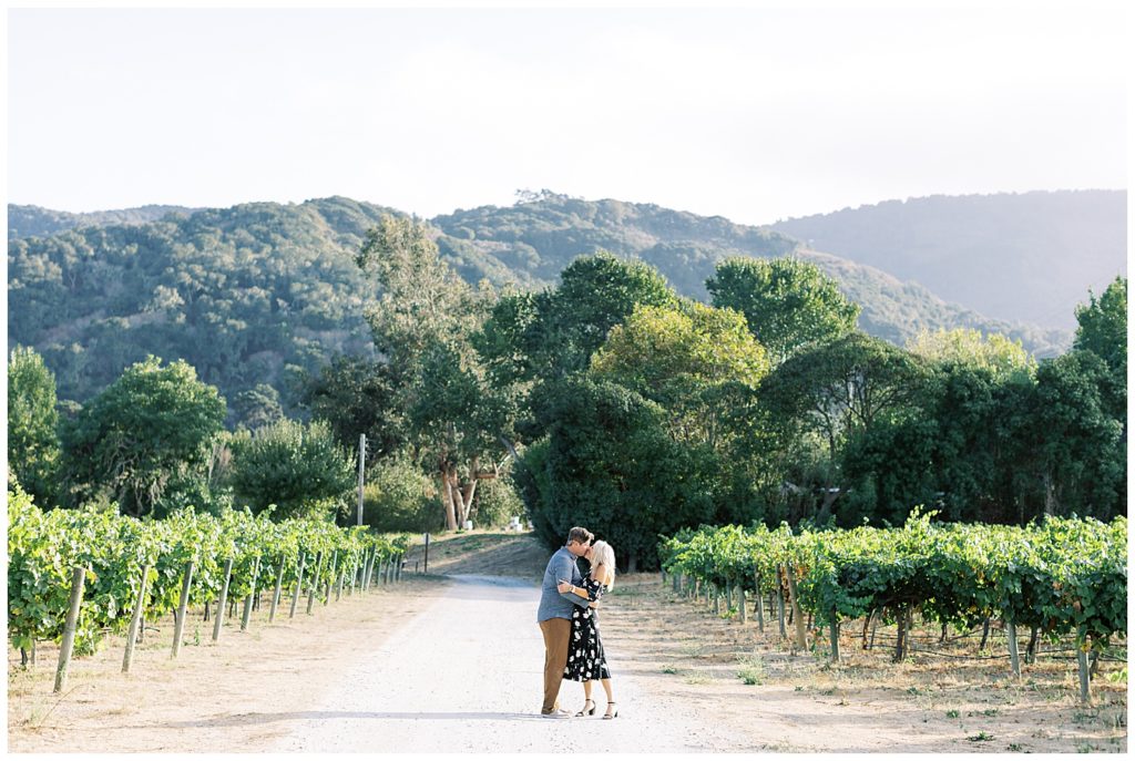 Engagement at the Beautiful Folktale Winery in Carmel, CA with green vineyards and rolling trees in the background by film photographer AGS Photo Art