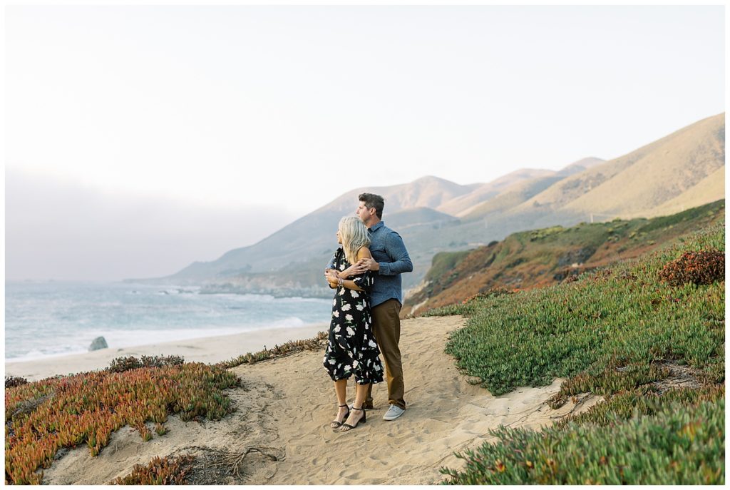 After their Folktale Winery engagement, the couple goes to Garrapoda State Park Beach in Big Sur where they stand in each other's arms and look out at the waves
