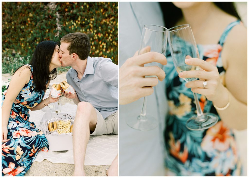 the couple enjoying their In N Out Surprise Proposal with a kiss and clinking their champagne flutes together, the woman's ring is featured in a soft focus by film photographer AGS Photo Art