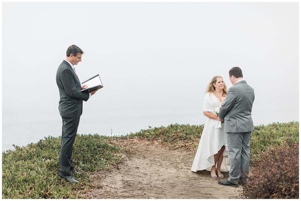 elopement couple portrait with the bride and groom's officiant in Big Sur, CA
