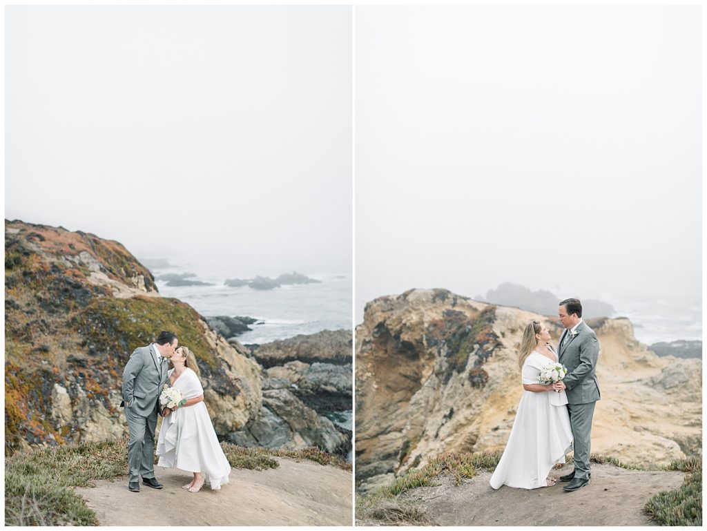 bride and groom sharing a kiss on their Big Sur, CA elopement day as they stand on a sandy pathway leading along the cliffside where you can see the ocean in the background