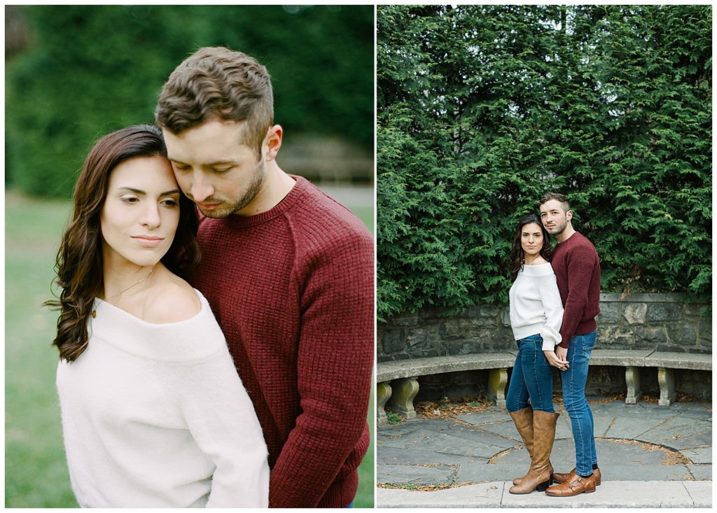 couple portraits of a woman in a white sweater and her fiancé in a red sweater as they're looking at the camera