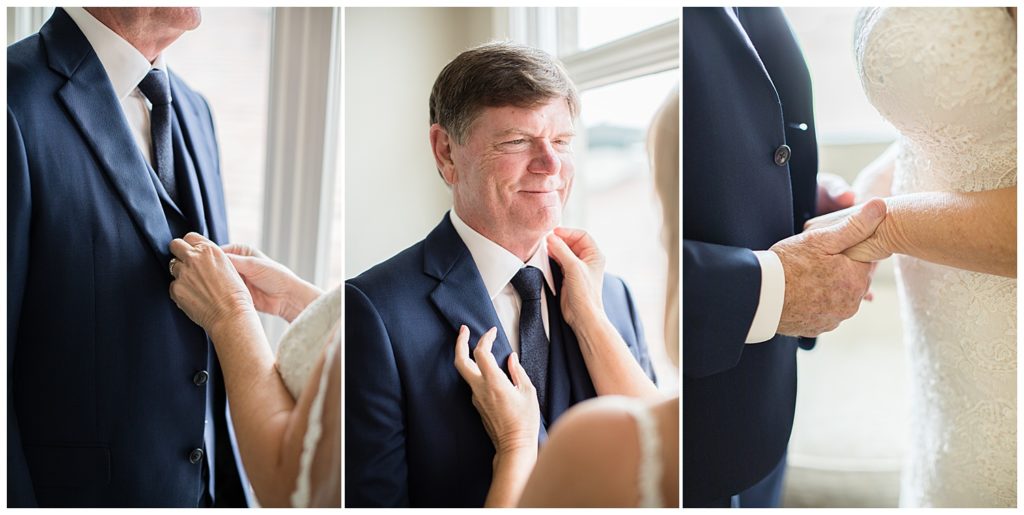 The bride adjusting her groom's collar and tie; close up of the couple's hands holding each other's