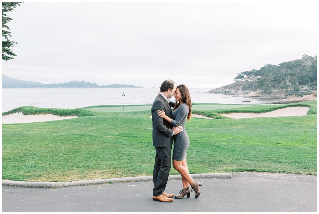 Couple in each other's arms for their Proposal Portraits at the Pebble Beach Lodge golf course by film photographer AGS Photo Art