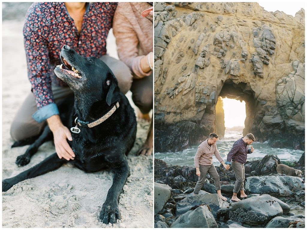 a close up photo of a black labrador on the sand with his two dads; a portrait of the couple adventuring on the rocks at Pfeiffer Beach