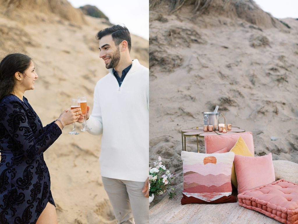 pink pillows and beige picnic set up with couple and their champagne flutes
