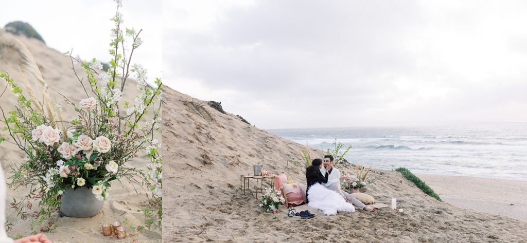 floral arrangement by Seascape Flowers; couple enjoying their picnic on the beach