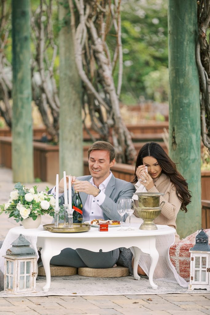 couple tearing up and enjoying their surprise proposal picnic at Bernardus Lodge