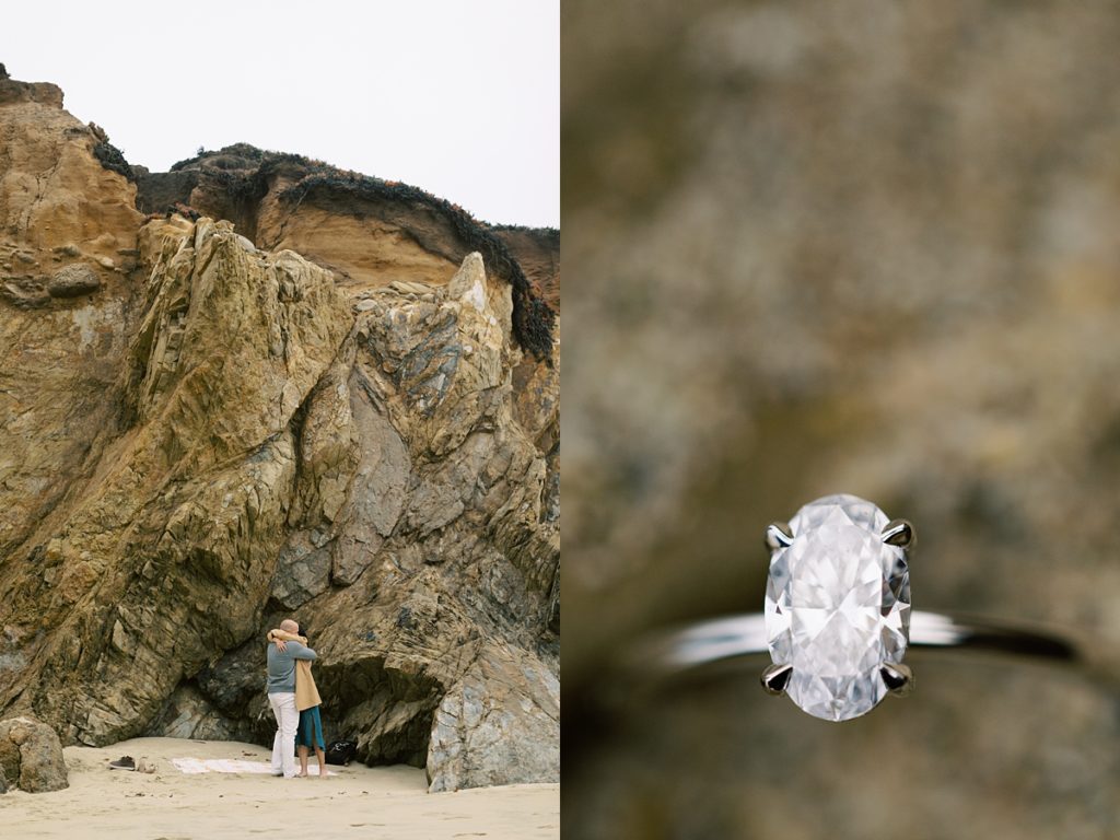 couple embracing during their Big Sur beach proposal; oval ring in focus