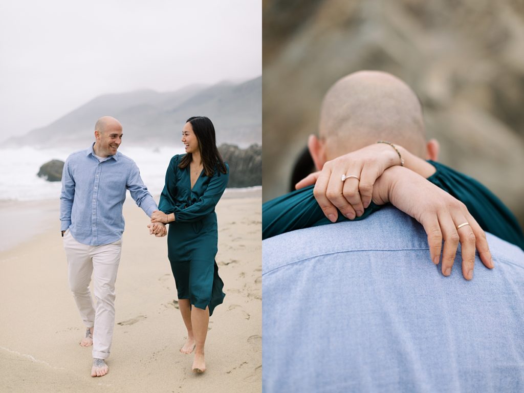 couple walking down the sand at Garrapata Beach in Big Sur for their surprise proposal; photo from behind the man's back with his fiancée's arms wrapped around his neck