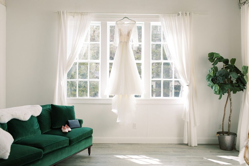 BHDN wedding dress hanging in the window