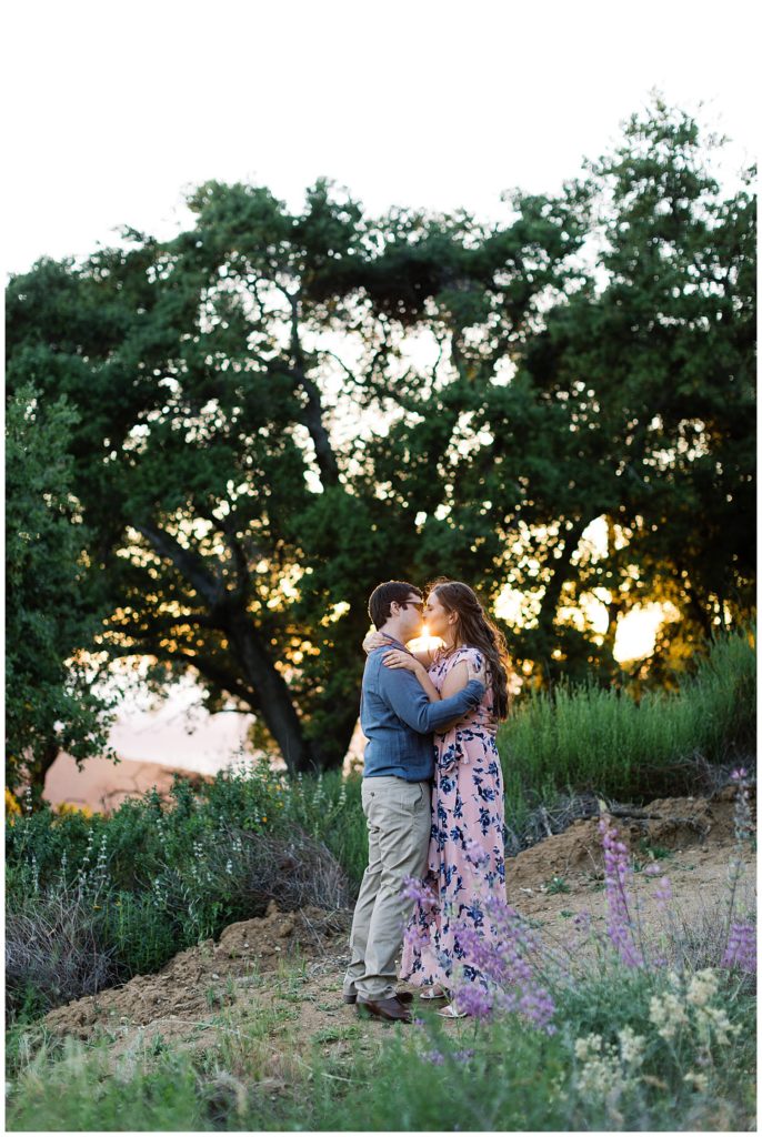 couple sharing a kiss during their Big Sur sunset engagement session