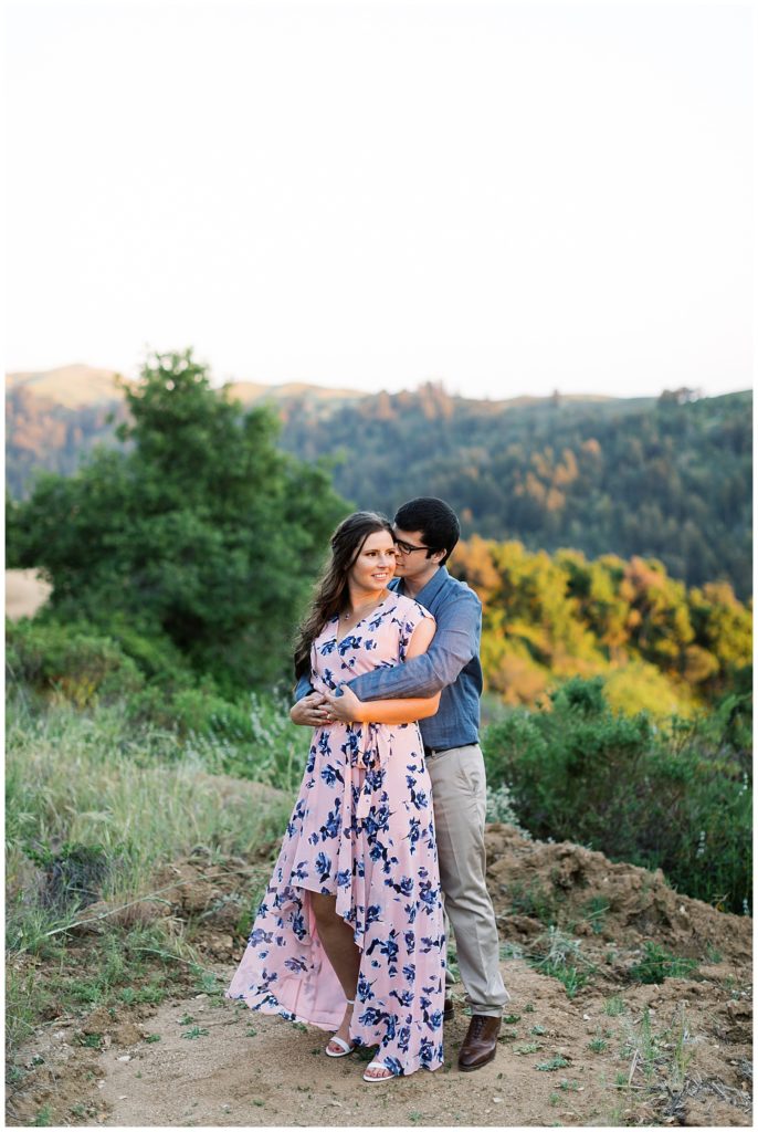 private engagement session portrait of the couple with the forest behind them by film photographer AGS Photo Art