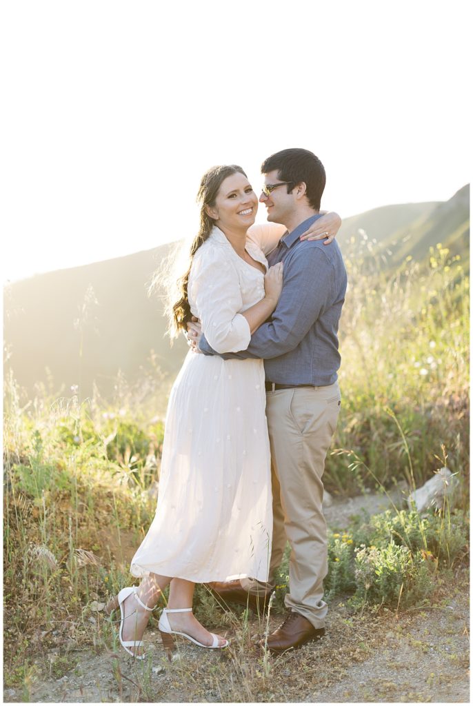 portrait of couple in a white dress and a blue button up with khakis in Big Sur