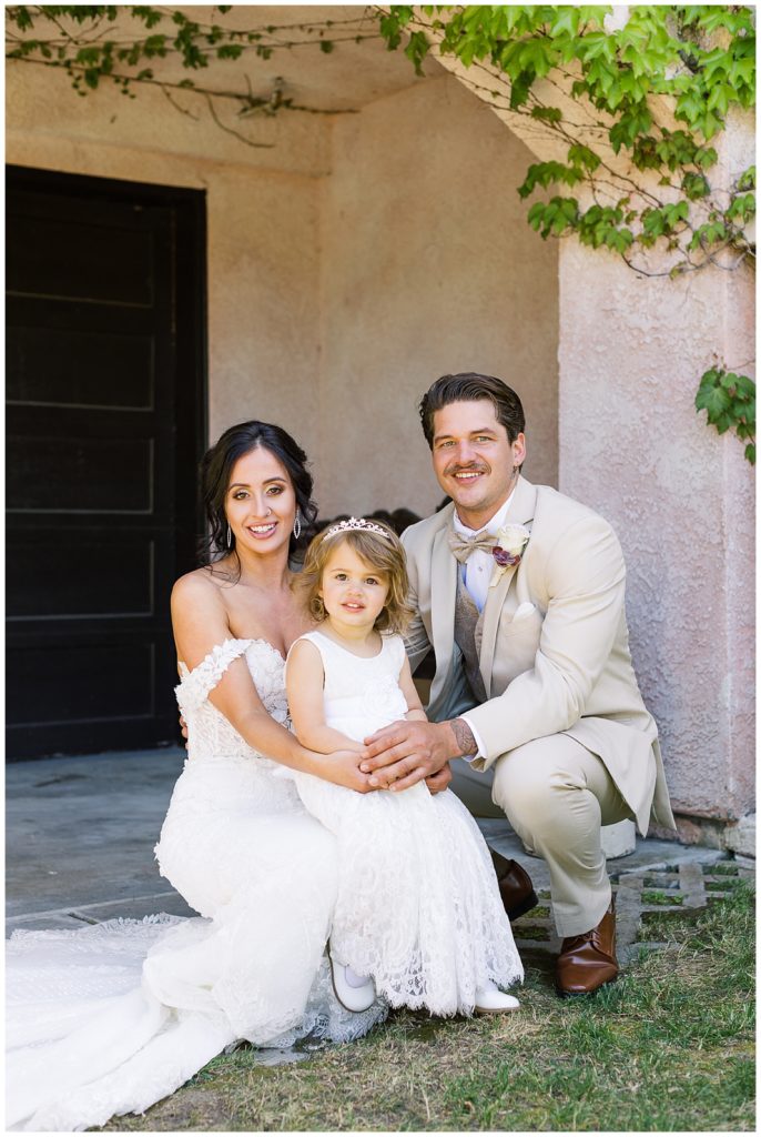 portrait of the bride, groom, and their daughter during their Chateau Carmel wedding First Look