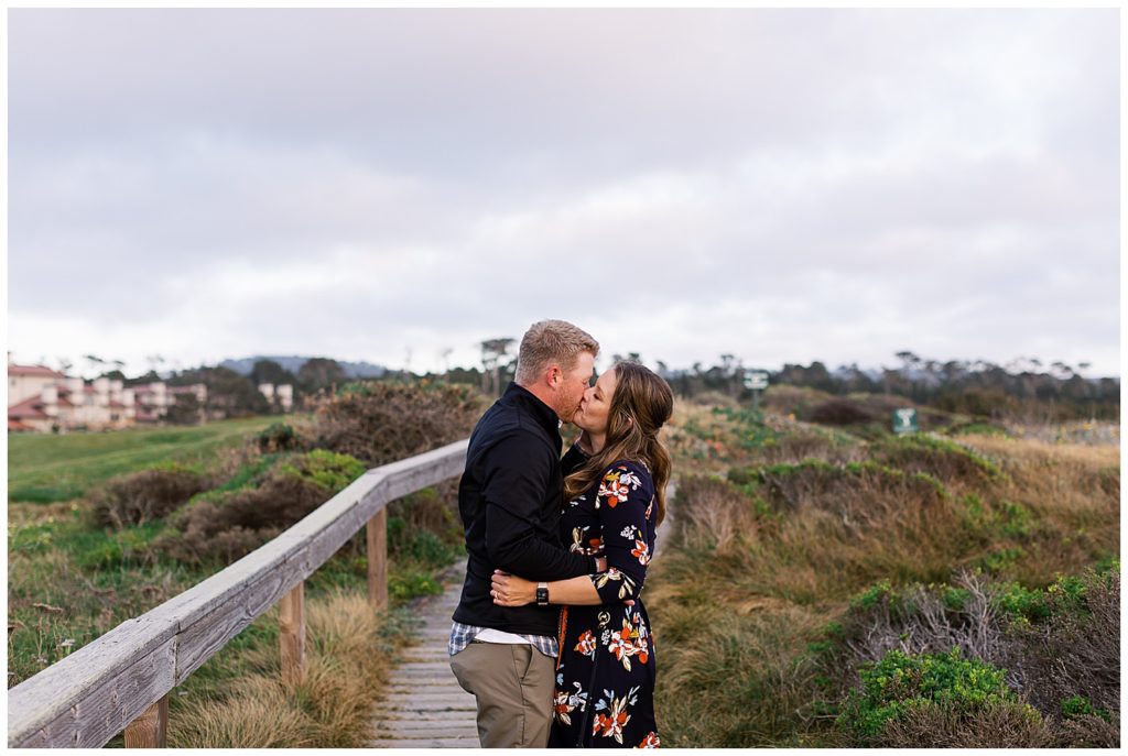 couple sharing a kiss at their Pebble Beach engagement