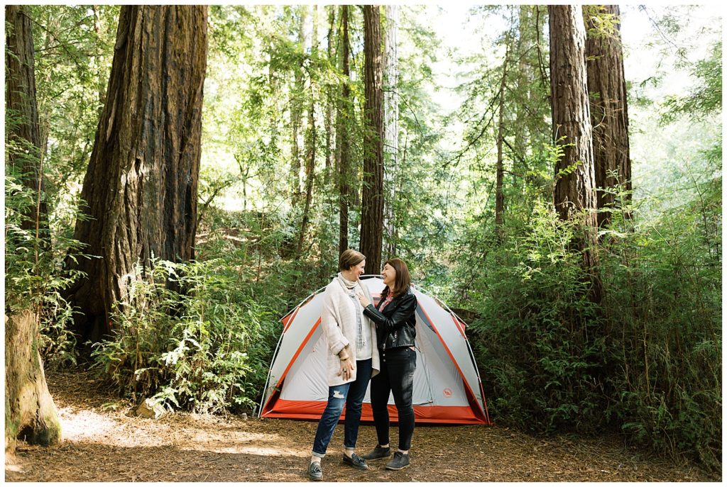 same-sex couple in front of their tent at the Ventana campgrounds for their Big Sur engagement session by film photographer AGS Photo Art