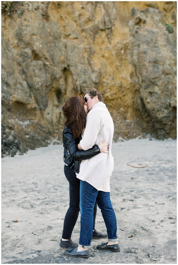 Coast & Cliffs Ventana Engagement Session portrait of the couple sharing a kiss