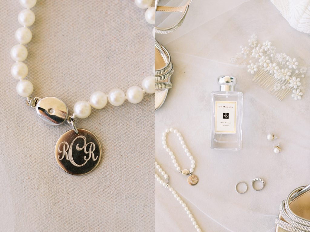 bride's pearl jewelry (bracelet with the initials RCR on the clasp, wedding ring and band, earrings, flower hair pieces), Jo Malone perfume, and Badgley Mischka shoes by film photographer AGS Photo Art
