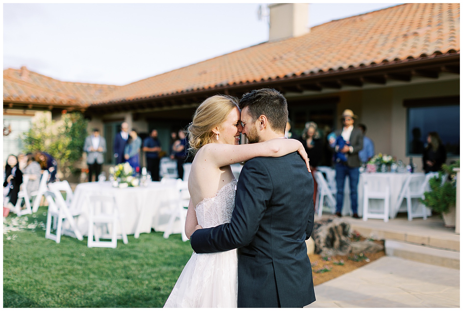 bride and groom embracing each other surrounded by their friends and family at their Intimate Wedding Photography At Private Estate Wedding In Hollister by film photographer AGS Photo Art